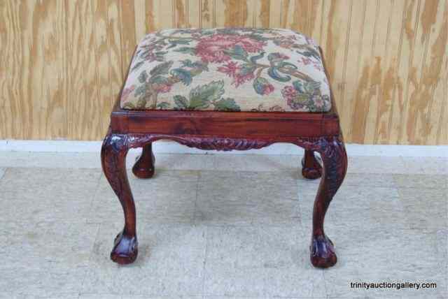 Appraisal: Carved Mahogany Large Stool Ornately detailed with a thick cushioned