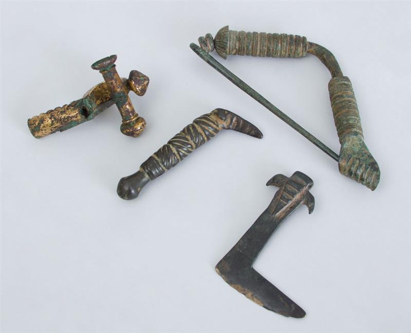 Appraisal: GROUP OF FOUR BRONZES Including two axe heads a fibula