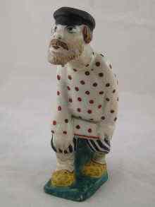 Appraisal: A Soviet Russian ceramic figure of a man indistinct marks