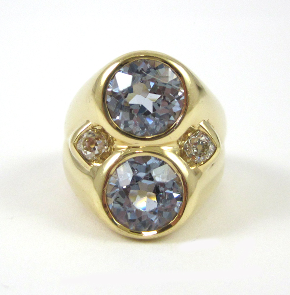 Appraisal: AQUAMARINE AND EIGHTEEN KARAT GOLD RING set with two round-cut