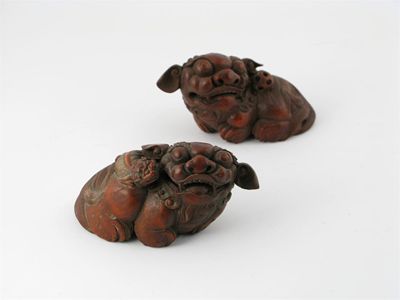 Appraisal: A pair of Chinese bamboo carvings of lion dogs the