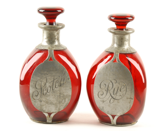 Appraisal: Two Red Glass Liquor Decanters marked Rye and Scotch with