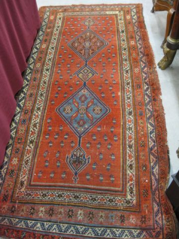 Appraisal: Persian Handmade Rug geometric medallions designs on red field '