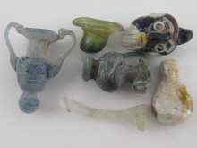 Appraisal: Six miniature glass items possibly ancient including a face pendant