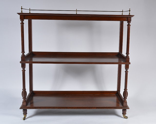 Appraisal: A mahogany and brass three tier buffet cm wide cm