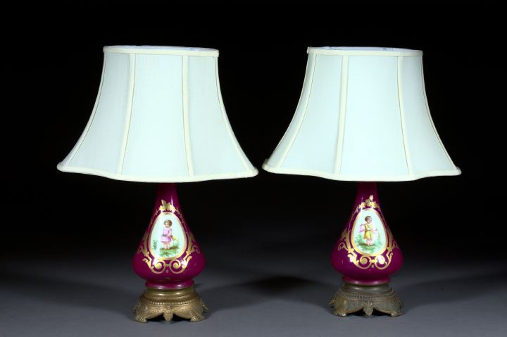 Appraisal: Pair of French Gilded Cast-Iron-Mounted Claret Ground Porcelain Kerosene Parlor