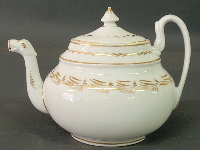 Appraisal: Philadelphia Tucker porcelain teapot with gilt sprig decoration and bird-head