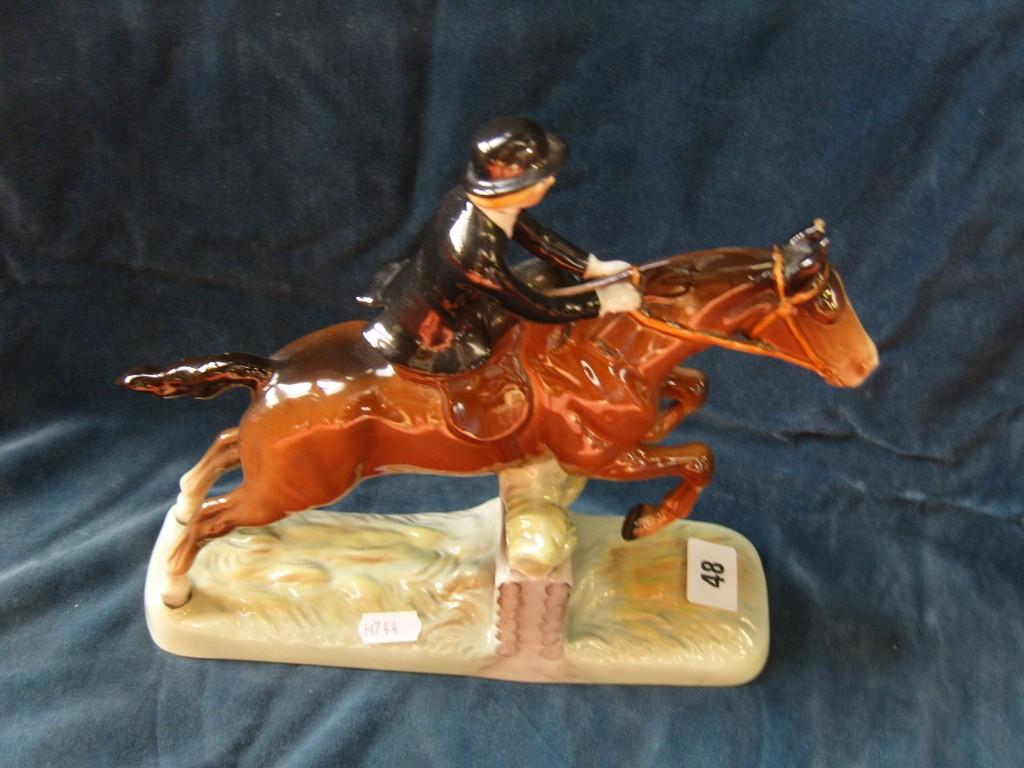 Appraisal: A Beswick model of a lady in black riding habit