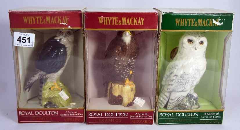 Appraisal: Royal Doulton Whyte Mackay decanters comprising Buzzard Merlin and Snowy