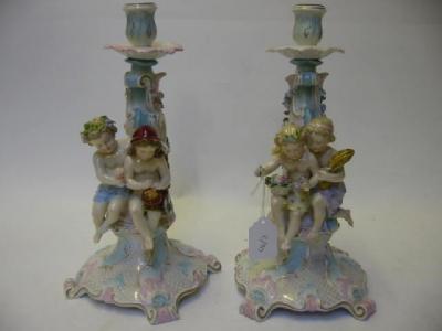 Appraisal: A PAIR OF SITZENDORF PORCELAIN FIGURAL CANDLESTICKS allegorical of Summer