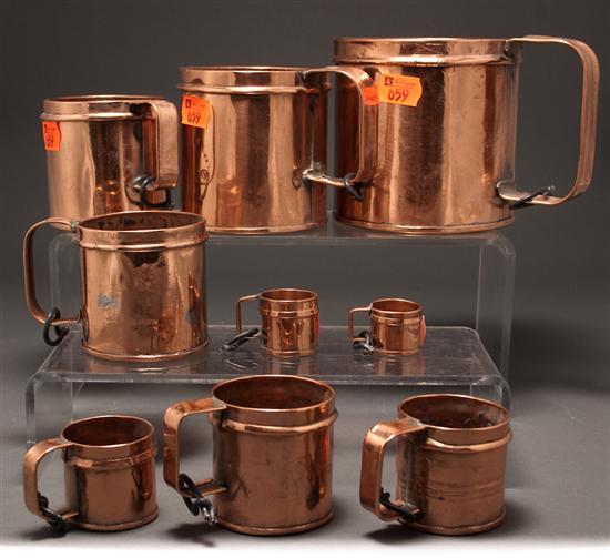 Appraisal: Set of nine English copper graduated measures second half- th