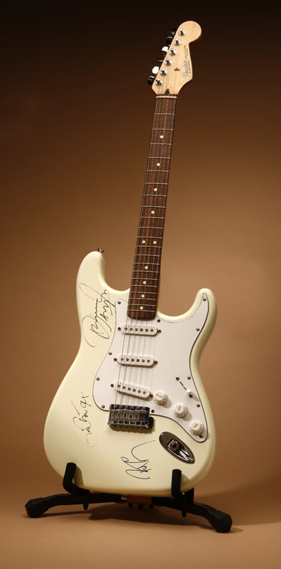 Appraisal: A Fender Stratocaster white electric guitar signed Eric Clapton Jimmie