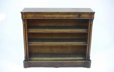 Appraisal: A Victorian walnut and gilt metal mounted bookcase the open