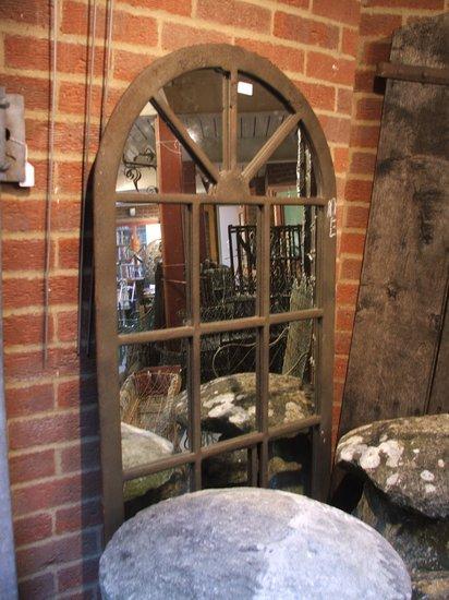 Appraisal: AN OLD IRON FRAME WINDOW with shaped fan top later