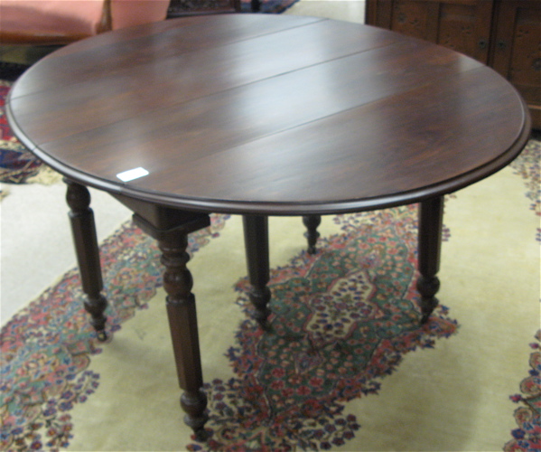 Appraisal: VICTORIAN WALNUT DROP-LEAF DINING TABLE WITH FOUR LEAVES American late