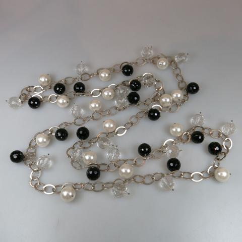 Appraisal: Sterling Silver Oval Link Chain suspending faceted onyx beads crystal