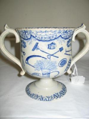 Appraisal: AN ENGLISH PEARLWARE LOVING CUP with scroll handles and pedestal