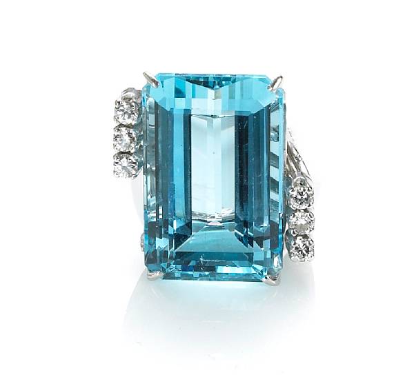 Appraisal: An aquamarine and diamond ring centering a rectangular-cut aquamarine weighing