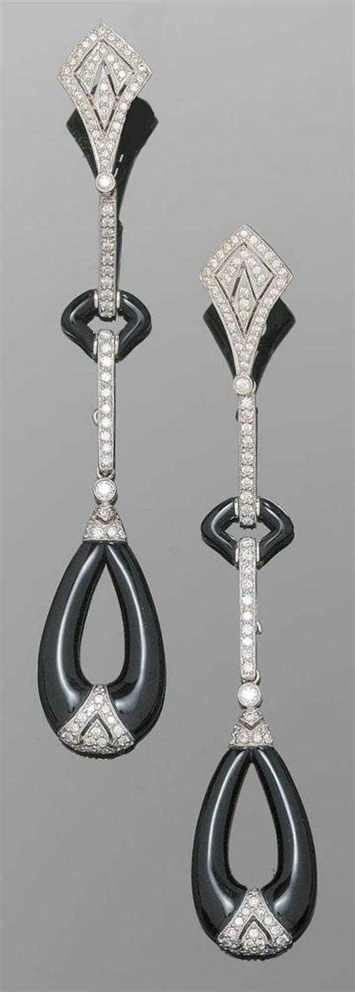 Appraisal: ONYX AND BRILLIANT-CUT DIAMOND PENDANT EARRINGS White gold Decorative long