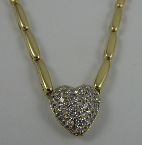 Appraisal: DIAMOND AND K GOLD HEART PENDANT NECKLACE the pendant suspended