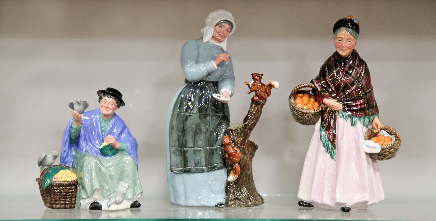 Appraisal: THREE ROYAL DOULTON FIGURINES England mid to late th century