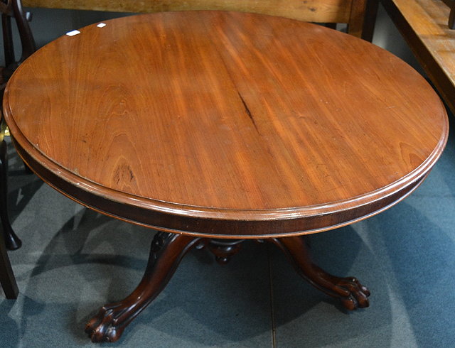 Appraisal: A Victorian mahogany circular breakfast tablewith tip-up top on a