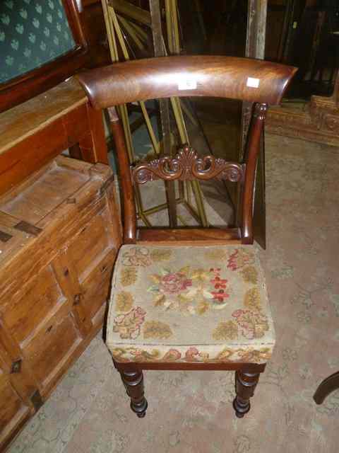 Appraisal: A REGENCY MAHOGANY SPADE BACK CHILD'S CHAIR with carved splat