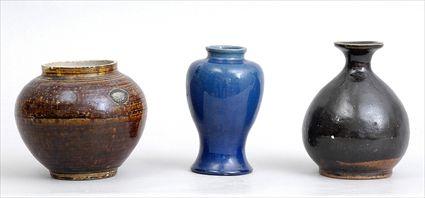 Appraisal: TWO JAPANESE BROWN-GLAZED POTTERY ARTICLES AND A PORCELAIN VASE Comprising