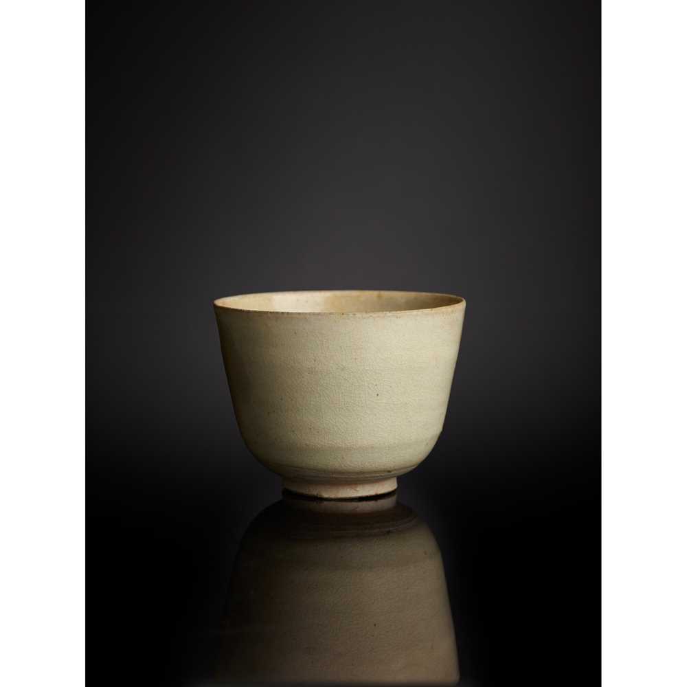 Appraisal: WHITE-GLAZED STONEWARE CUP TANG DYNASTY thinly potted of deep U-shape