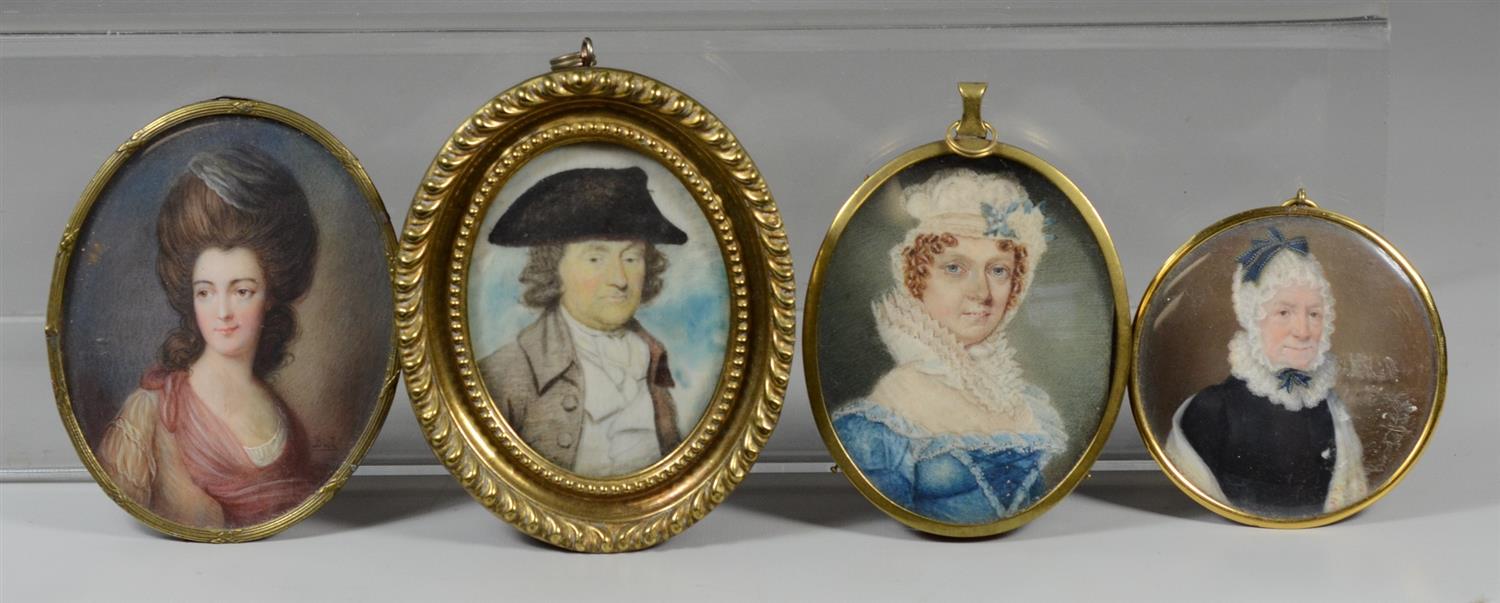 Appraisal: th c hand painted portraits on ivory in metal frames