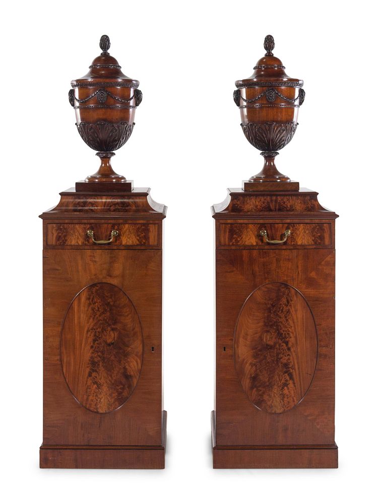 Appraisal: A Pair of Edwardian Style Mahogany Cutlery Urns on Pedestals