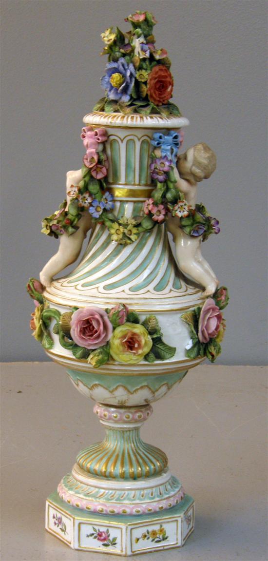 Appraisal: Early twentieth century floral encrusted vase with figural handles on