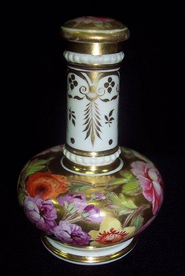 Appraisal: An English porcelain scent bottle and stopper painted flowers on