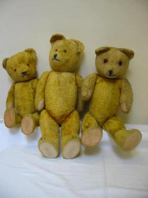 Appraisal: A Continental teddy bear straw filled covered in yellow plush