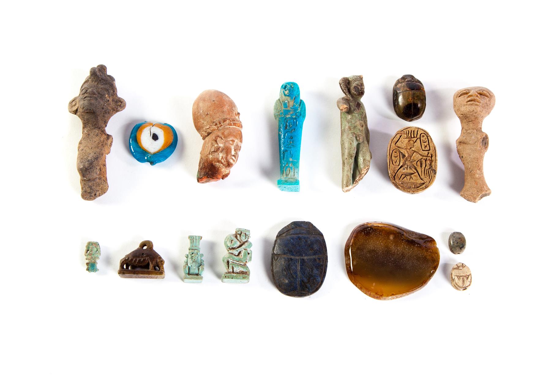 Appraisal: GROUP OF ARTIFACTS Egyptian scarabs ushabti and faience pendants Pre-Columbian