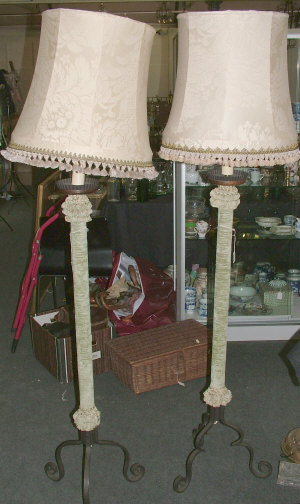 Appraisal: A pair of velvet covered wrought iron standard lamps on