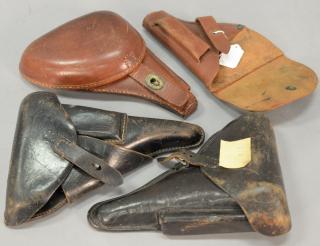 Appraisal: Group of four holsters including two German WWII leather pistol