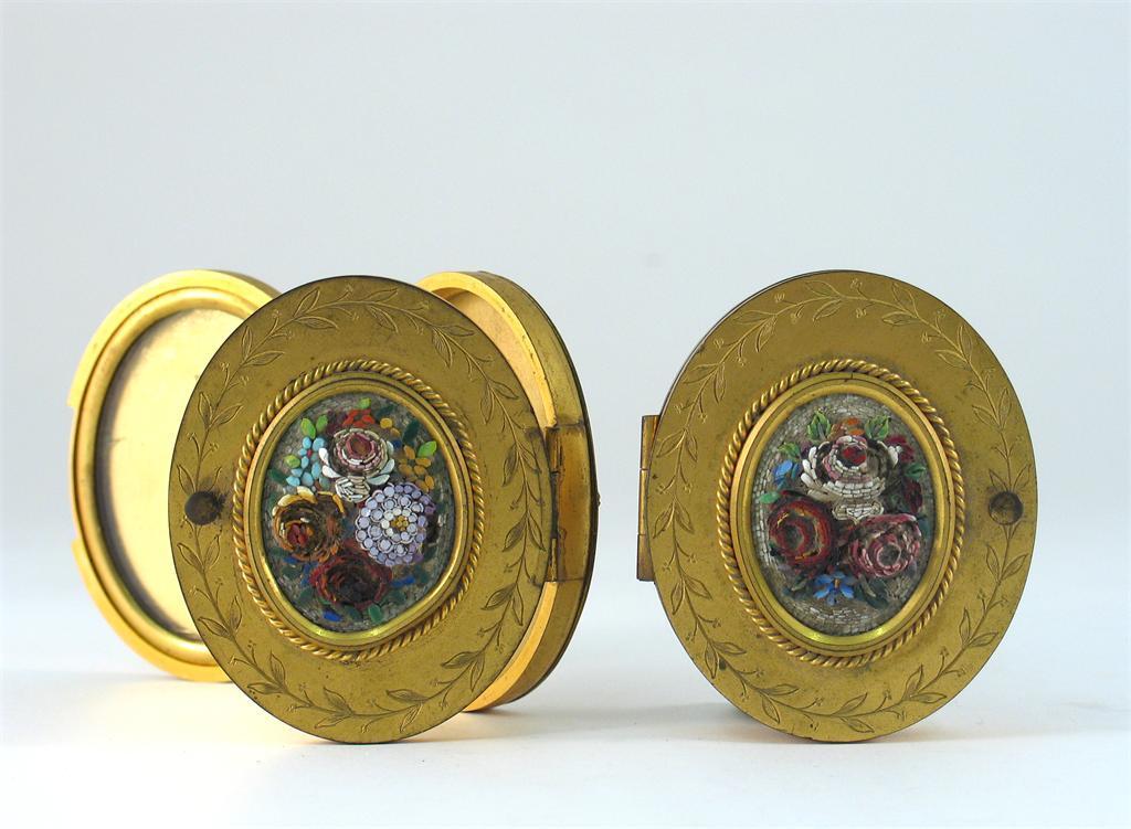 Appraisal: A pair of gilt metal oval photo frames