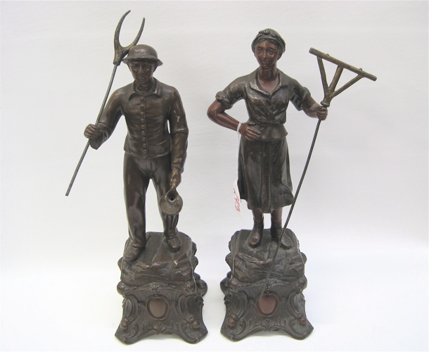 Appraisal: PAIR OF SPELTER SCULPTURES of man and woman working the