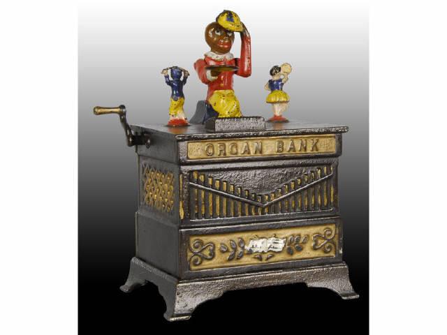 Appraisal: Cast Iron Organ Mechanical Bank Description Has dancing boy and