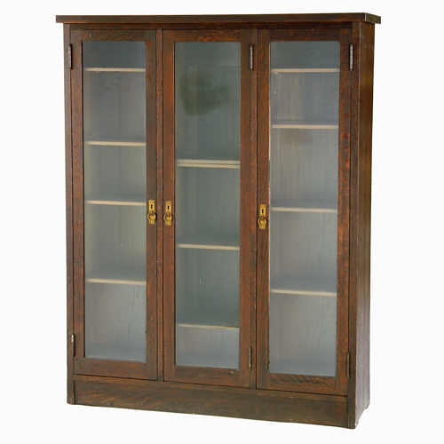 Appraisal: MICHIGAN CHAIR COMPANY Three-door bookcase with circular pulls and adjustable