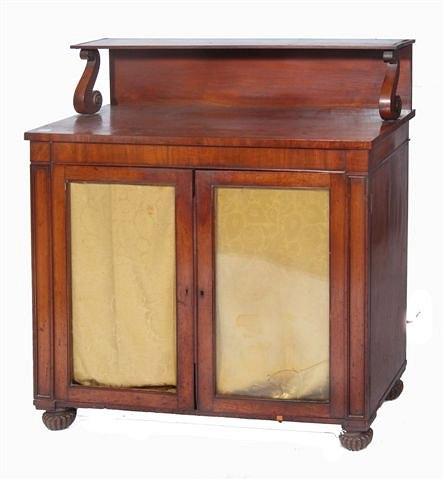 Appraisal: A REGENCY MAHOGANY CHIFFONIER the interior fitted shelves enclosed by