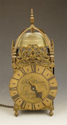 Appraisal: A brass lantern clock with an anchor escapement and a