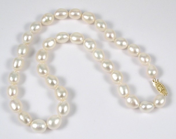 Appraisal: PEARL AND FOURTEEN KARAT GOLD NECKLACE - in length and