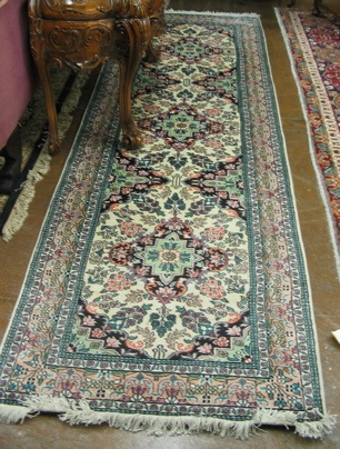 Appraisal: A CONTEMPORARY ORIENTAL RUNNER Indo-Persian faux silk floral and floral