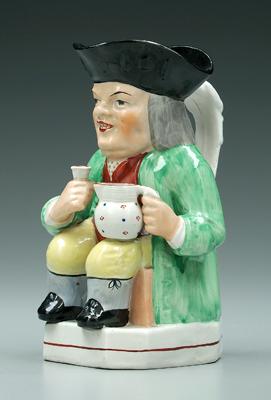 Appraisal: Staffordshire Toby jug seated man with pitcher and cup green