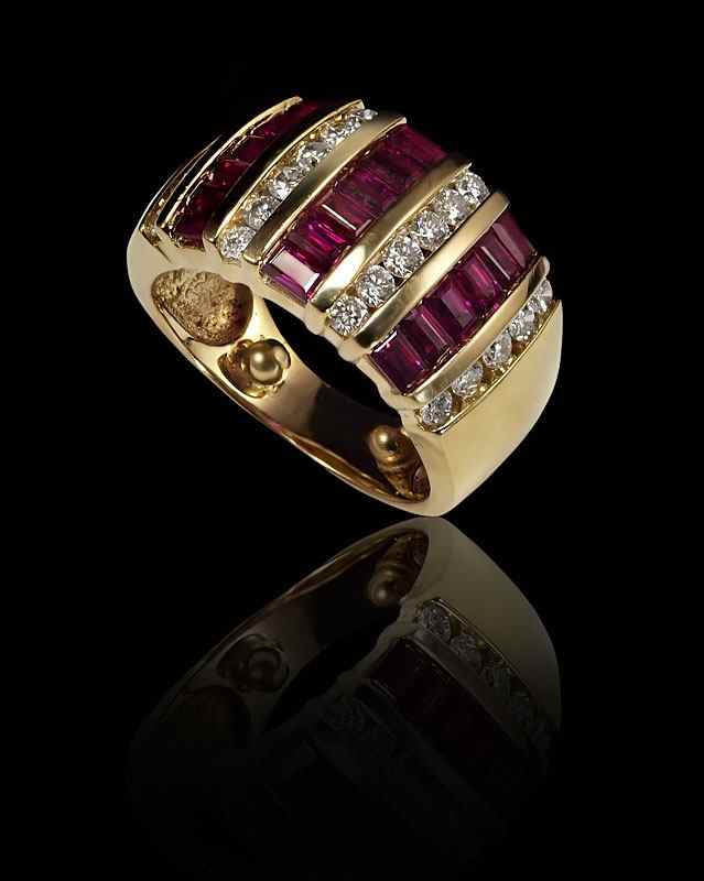 Appraisal: K RUBY DIAMOND RING K yellow gold ring contains round