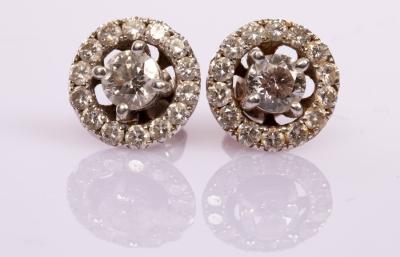 Appraisal: A pair of diamond halo cluster ear studs the central