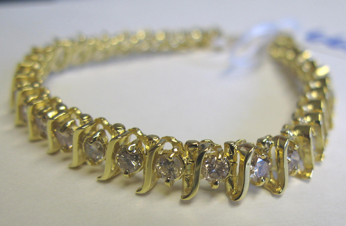 Appraisal: DIAMOND AND FOURTEEN KARAT GOLD BRACELET The seven inch bracelet