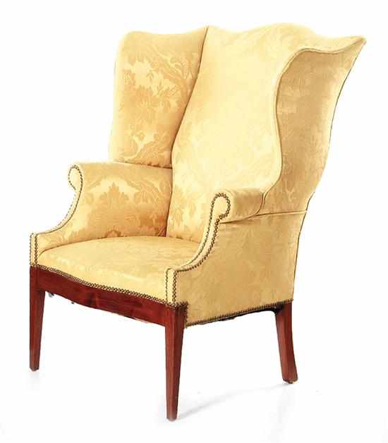 Appraisal: Federal style mahogany upholstered wingback armchair th century curved crest